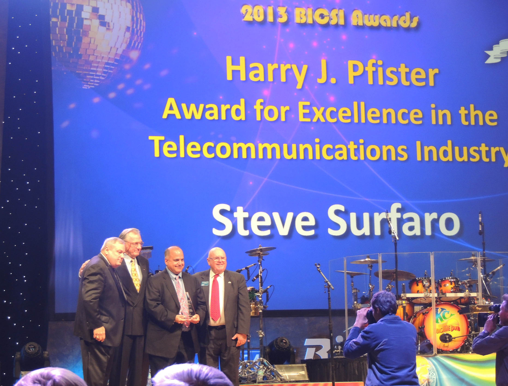 Left to right: Jerry Bowman, BICSI President; Mel Anderson, Ph.D.,USF - College of Engineering; Steve Surfaro, Axis Communications; and Harry Pfister, BICSI Past President during the awards presentation at the 2013 BICSI Winter Conference & Exhibitions.