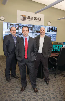 AISG President and CTO Levi Acs (front) is flanked by Arnold Koble, VP engineering (left) and Rocco Lipari, national operations director (right), inside the company's central monitoring facility. AISG President and CTO Levi Acs (front) is flanked by Arnold Koble, VP engineering (left) and Rocco Lipari, national operations director (right), inside the company's central monitoring facility.