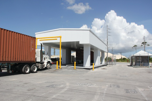 A cargo truck prepares to enter the Decision Sciences&rsquo; multi-mode passive detection system. The company&rsquo;s scanning technology cosmic ray charge particles to determine the density of objects within cargo containers.