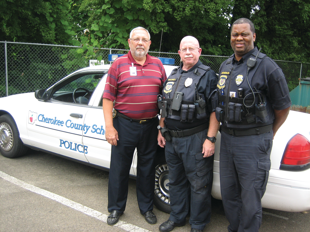 Mark Kissel, Cherokee Country Schools' Chief of Police stands outside the district's command center with police officers Todd Maloney and Brian Stevenson.
