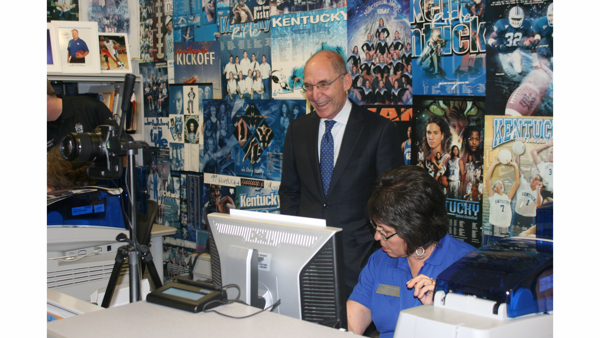 University of Kentucky President Eli Capilouto reviewis his new ID with adminstrator Karen Doyle.