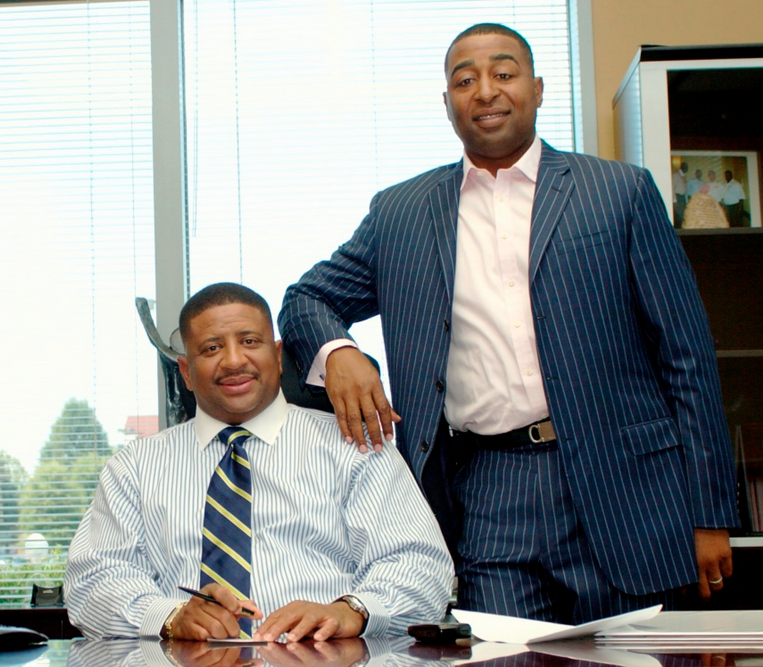 In Oct. 2012, Cris Carter, chairman (right), and John Carter, president (left), of the company known then as Carter Brothers LLC, sold the fire & life safety and commercial portion of their business to Tyco Integrated Security.