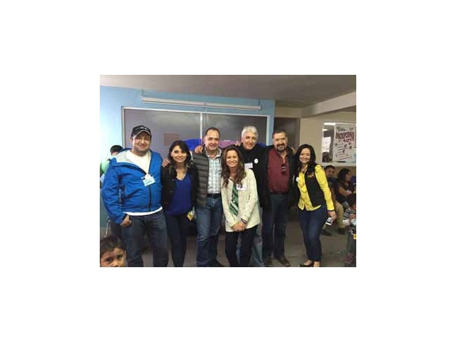 Security professionals at Ecatapec handing out toys to children . From l-r: Jonathan Garcia, Sagrario Garcia, Antonio Chavez, Andrea Ferrando George Fletcher, Paco Chavez-Melo and Indira Ribeiro.