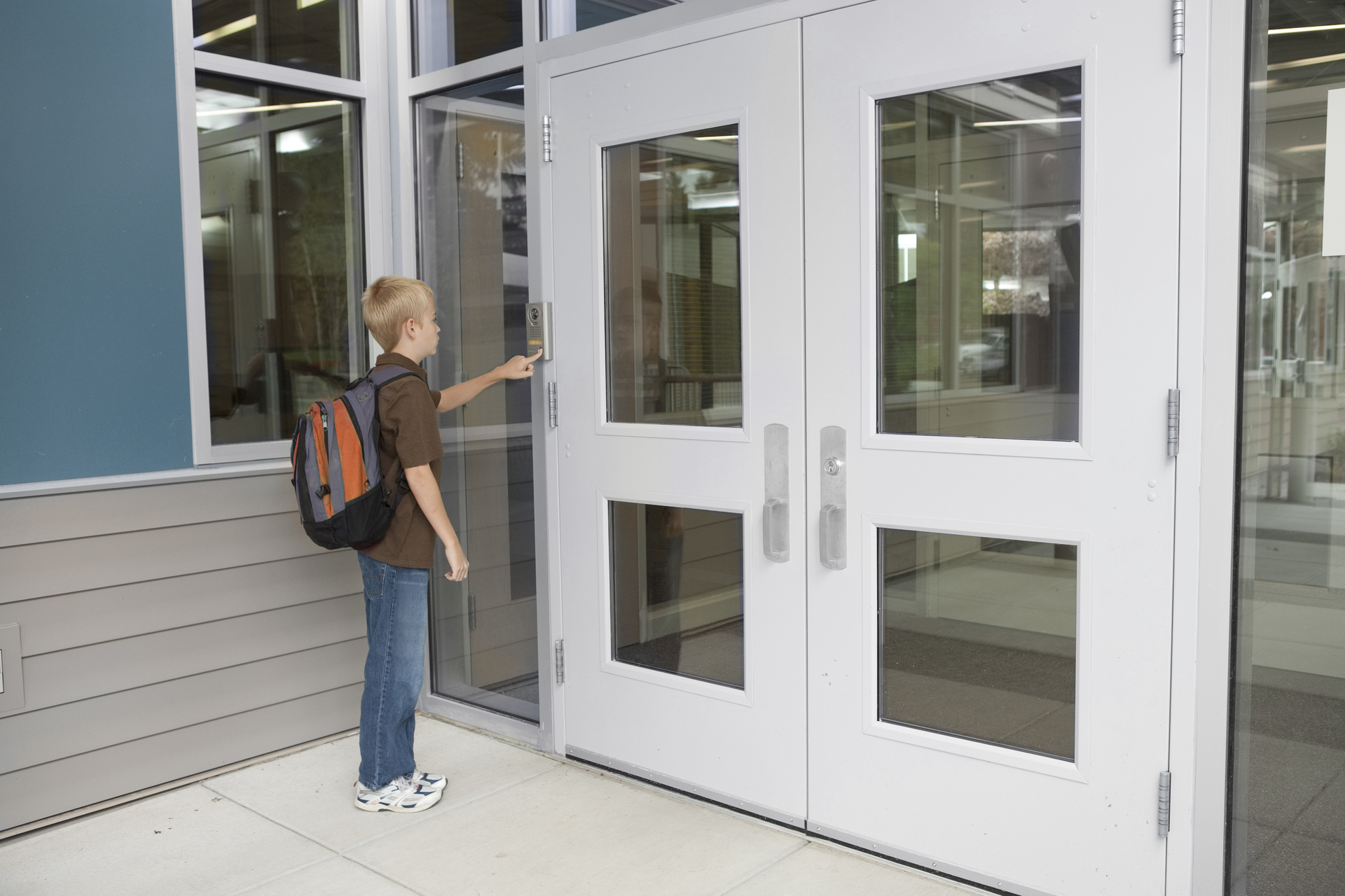 Intercom systems enable visitors to push a button outside locked doors to request entry.