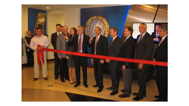 Tyco executives prepare to cut the ribbon at the company's newly expanded Global Center of Excellence in Birmingham, Ala. and plan global expansion of these sites in the near future.