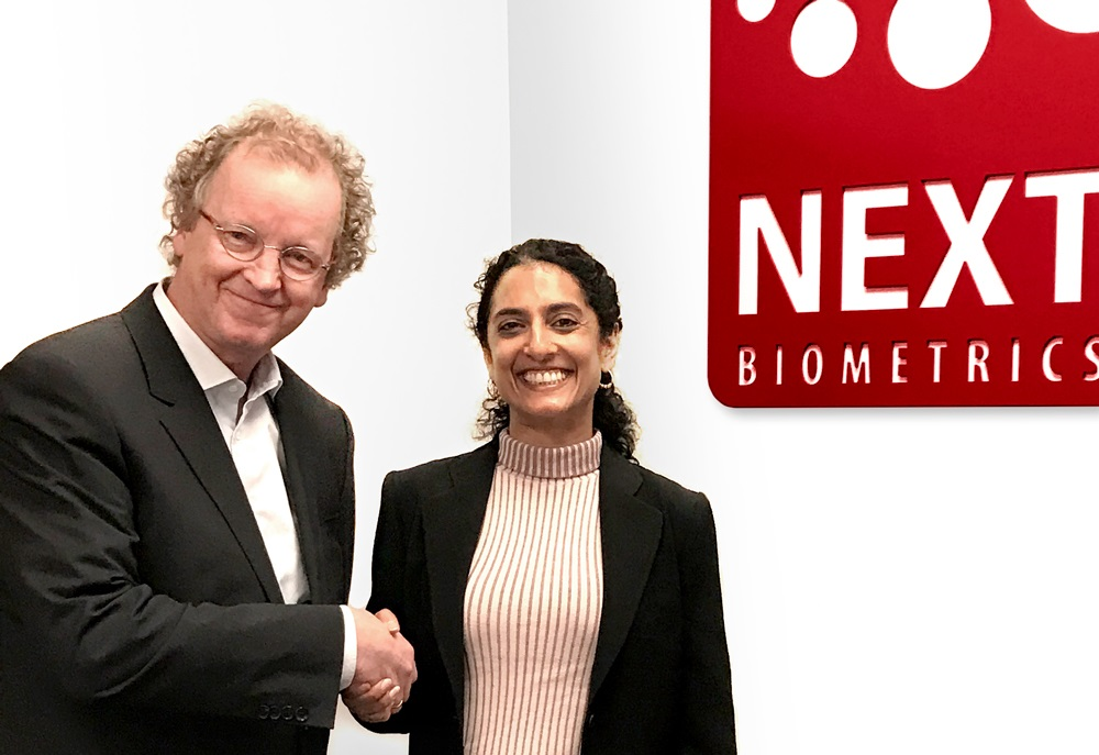 NEXT Biometric's Chairman of the Board Tore Etholm-Idsoe, left, shanks the hand of new CEO Ritu Favre.