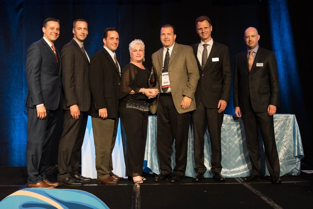 Pictured (left to right): Jeff Stanek, GM, Lenel; Michael Janikas, Sr. Acct Exec, Convergint; Sean Flint, Senior VP, Convergint; Kelle Shanks, Sr. Acct Exec, Convergint; Darren Wieder, Business Development Mgr., Convergint; Jurgen Timperman, President, Global Security Products, UTC Climate, Controls & Security; Alex Housten, VP & GM, Global Security Products, North America.