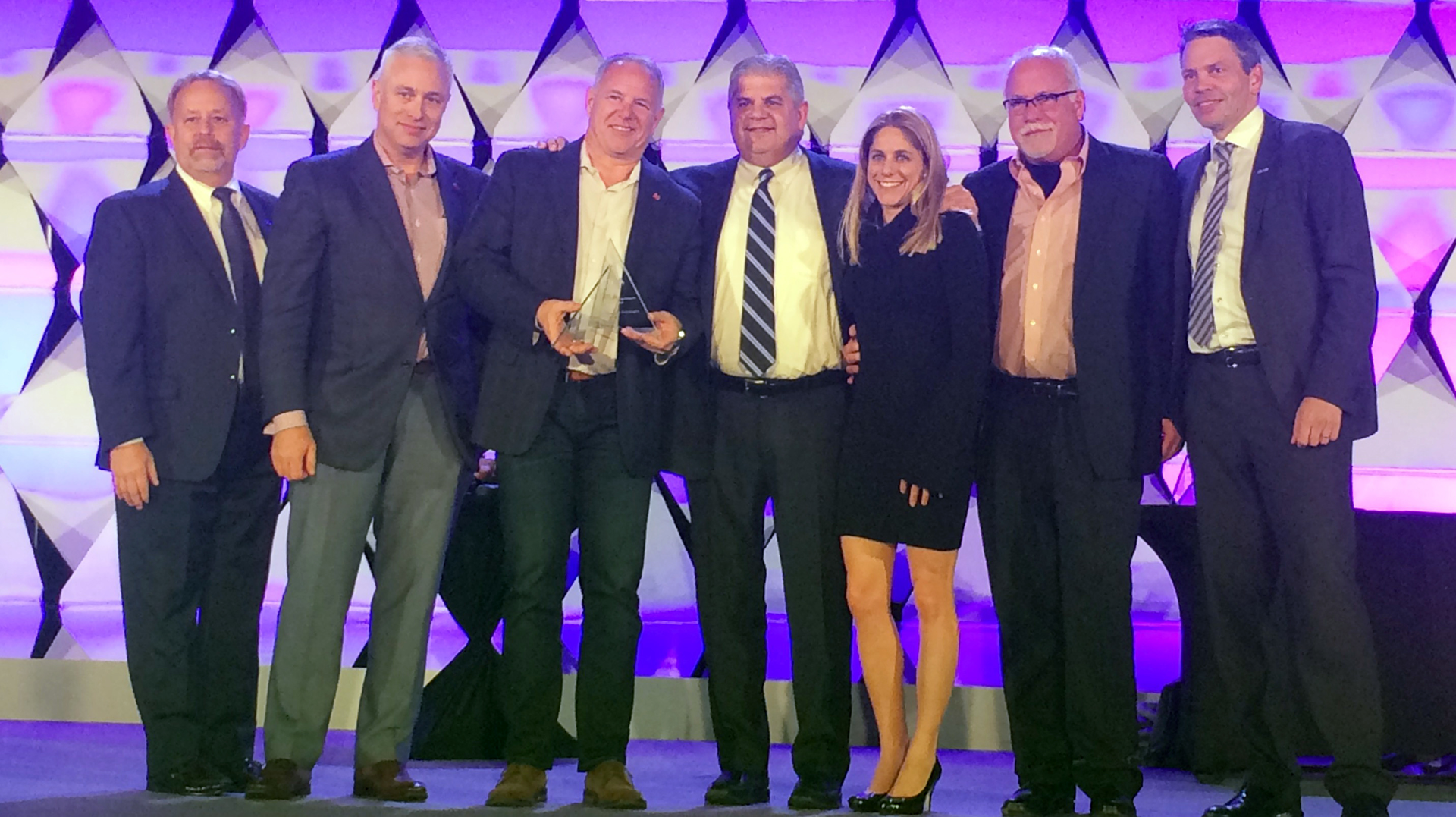 The Convergint team accepts the 2017 National Systems Integrator of the Year Award from Larry Newman (far left) and Fredrik Nilsson (far right) at Axis Connect & Converge in Seattle.