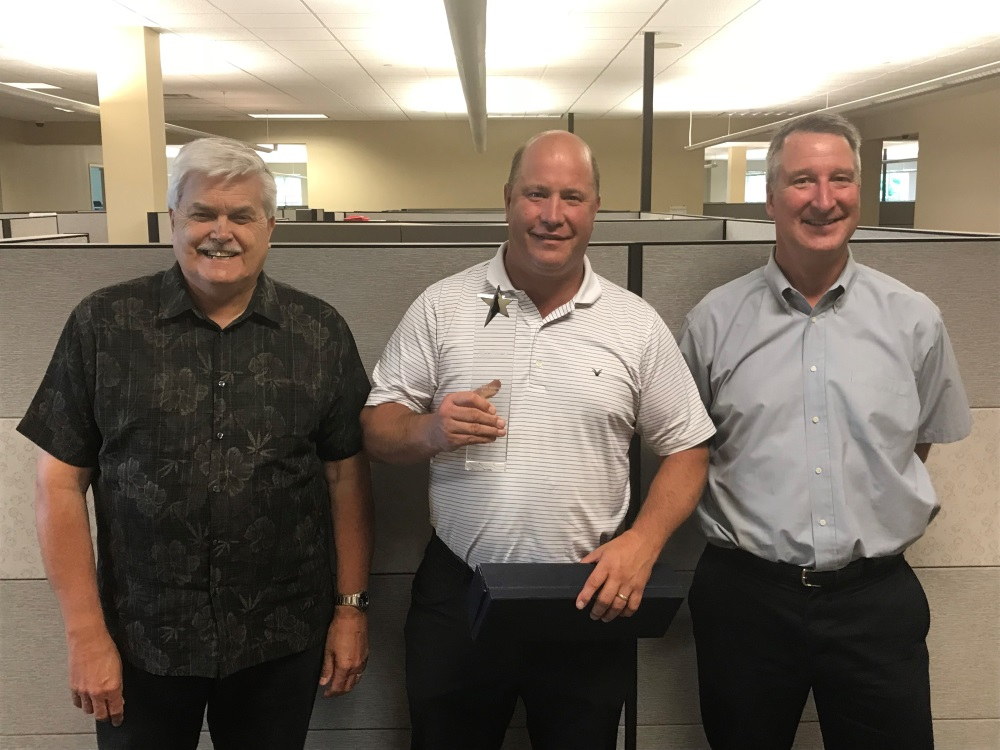 From left to right: Iverify&rsquo;s Marty Brakel, National Account Manager; David Heller, Chief Sales Officer; and Bill Guenther, National Account Manager, accepting their March Networks Rising Star channel partner award.