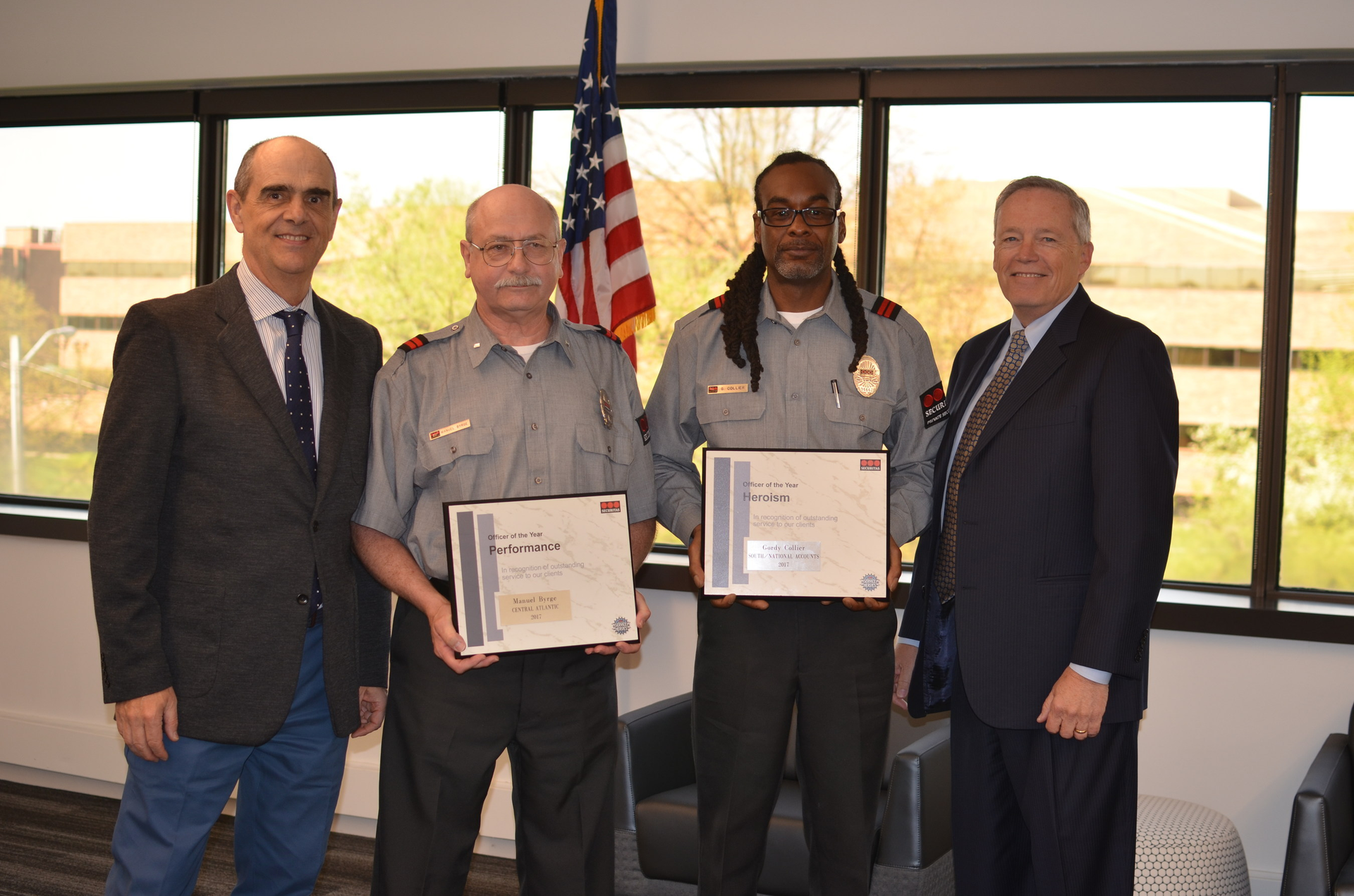 Officers Manuel Byrge (center left) and Gordon Collier (center right) were named Securitas Officer of the Year for Performance and Heroism, respectively. President and CEO, Securitas North America Santiago Galaz (far left) and Chief Operating Officer Bill Barthelemy.