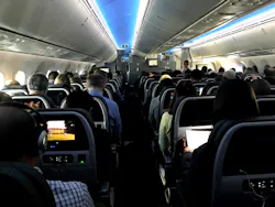 Main cabin passengers pass the time aboard American Airlines flight 2331, a Boeing 787-800 Dreamliner, an route from Chicago O'Hare International Airport to Dallas/Fort Worth International Airport, on March 5, 2018. Main cabin passengers pass the time aboard American Airlines flight 2331, a Boeing 787-800 Dreamliner, an route from Chicago O'Hare International Airport to Dallas/Fort Worth International Airport, on March 5, 2018.