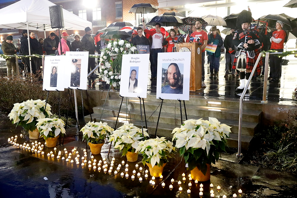 During the vigil Amazing Grace is played after a moment of silence to honor the victims. Students Demand Action, Moms Demand Action, Hudson Partnership CMO, and Jersey City Anti-Violence Coalition host a candlelight vigil outside Jersey City City Hall Annex to honor and remember the victims of the recent mass shooting. Friday, December 13, 2019.