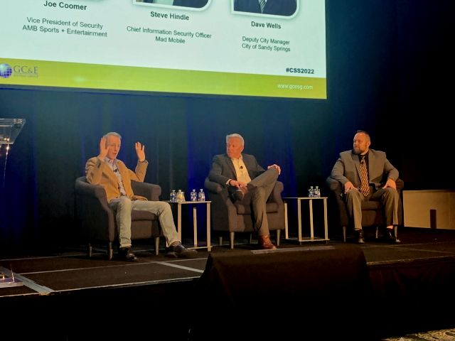 From left-to-right: Steve Hindle, Chief Information Security Officer, Mad Mobile; Dave Wells, Deputy City Manager for the City of Sandy Springs; and Joe Coomer, Vice President of Security, AMB Sports and Entertainment, speak during a panel discussion at the 2022 Converged Security Summit.