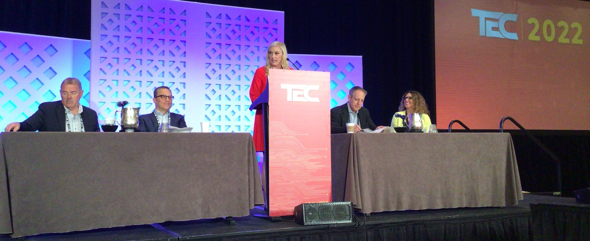 Candice Aragon, VP of Marketing and Events for PSA Security Network, introduces the highly anticipated State of the Industry Panel at PSA TEC, which included (L-R): Chuck Wilson, CEO of the National Systems Contractors Association (NSCA); James Rothstein, the new Chair of the Board of Directors for the Security Industry Association (SIA); Matt Barnette, CEO of PSA Security Network; and moderator Kasia Hanson of Intel.