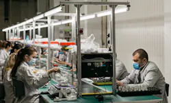 Workers assemble products from Ajax Systems at a Ukrainian facility. Workers assemble products from Ajax Systems at a Ukrainian facility.