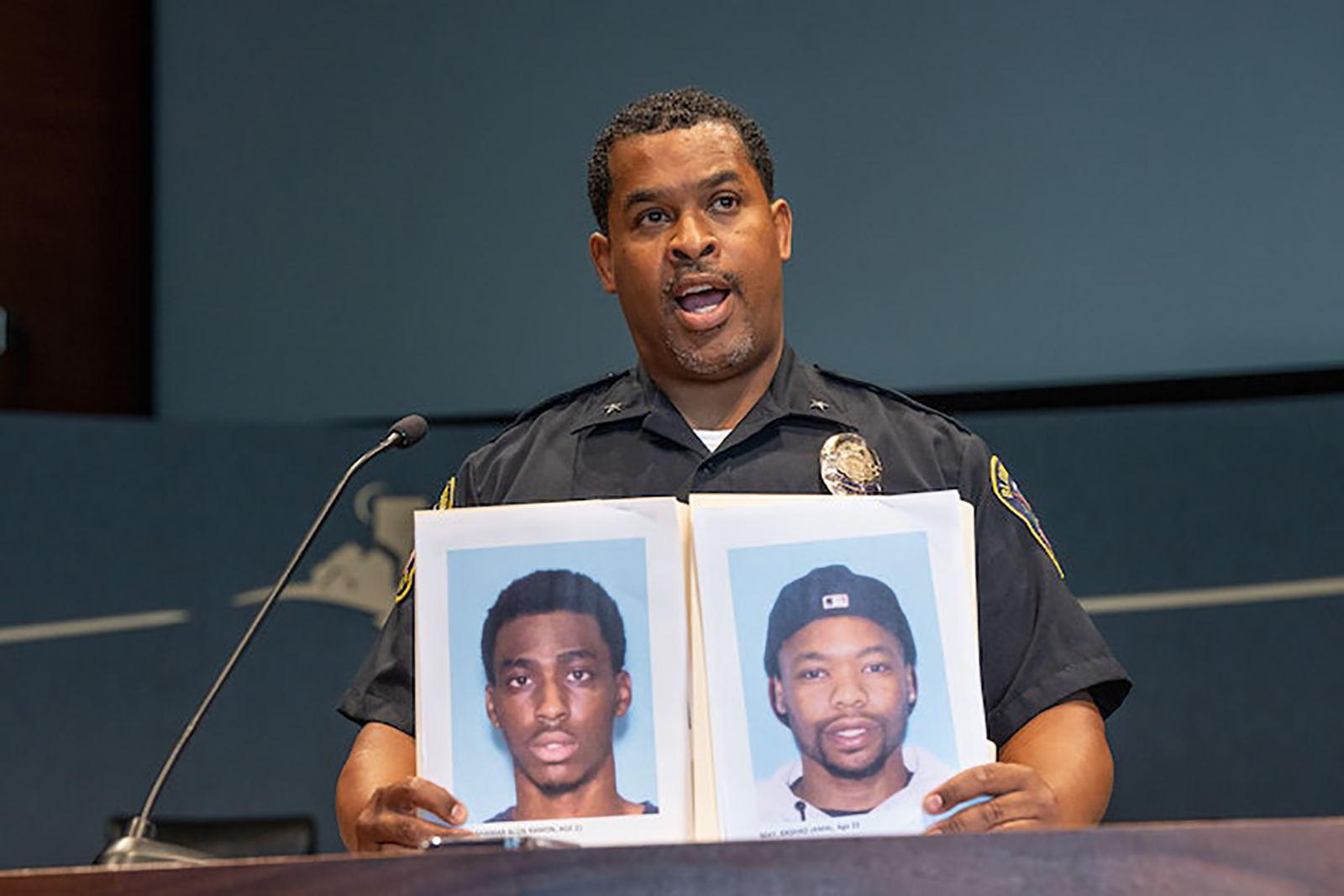 At a news conference Bloomington Police Chief Booker Hodges held up photos of Shamar Alon Lark, left, and Rashad Jamal May, sought in connection with gunfire inside the Mall of America last week on Aug. 8, 2022, in Bloomington, Minnesota.