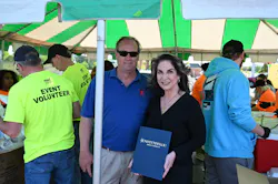Holmes Security Operations Director Duncan Hubbard was honored by Kathy Jensen, Mayor pro tem for the City of Fayetteville, during its Crimestoppers BBQ fundraiser. Holmes Security Operations Director Duncan Hubbard was honored by Kathy Jensen, Mayor pro tem for the City of Fayetteville, during its Crimestoppers BBQ fundraiser.