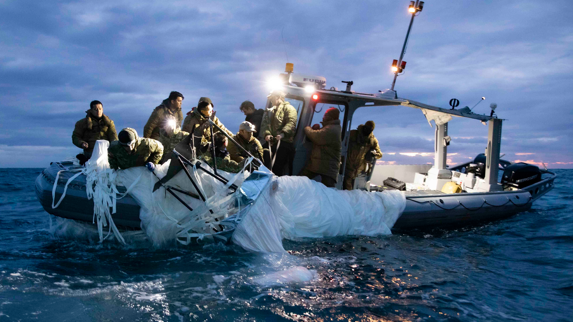 Sailors assigned to Explosive Ordnance Disposal Group 2 recover a high-altitude surveillance balloon off the coast of Myrtle Beach, S.C. on Feb. 5, 2023.