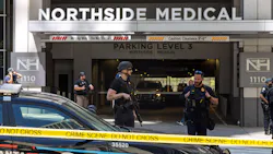 Law enforcement officers are seen on West Peachtree Street in front of Northside Hospital Midtown medical office building, where five people were shot on May 3, 2023. Law enforcement officers are seen on West Peachtree Street in front of Northside Hospital Midtown medical office building, where five people were shot on May 3, 2023.