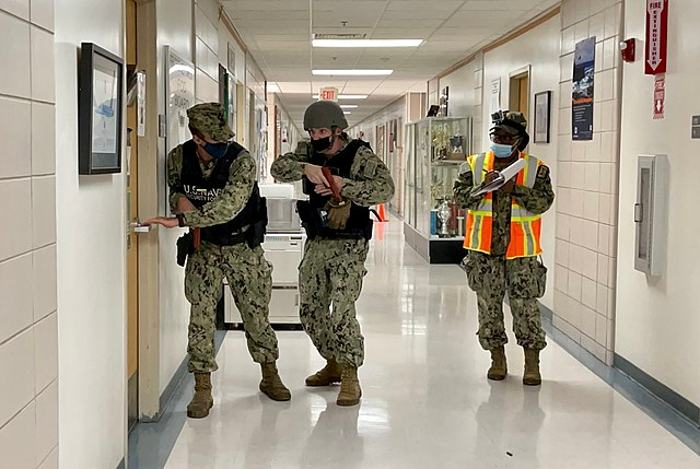 Navy security forces perform a sweep of a building during an active shooter training exercise at Naval Air Station Key West during Exercise Citadel Shield. Exercise Citadel Shield-