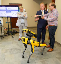 U.S. Rep. Kevin Hern (center) meets Krypto, one of TU’s robotic dogs U.S. Rep. Kevin Hern (center) meets Krypto, one of TU’s robotic dogs