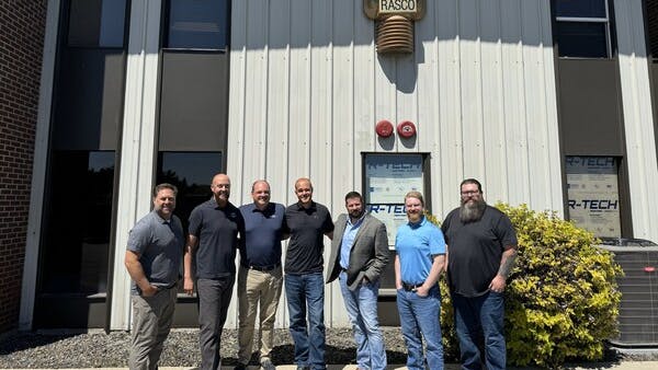 Pye-Barker's Matt Hammon, Justin Merrick, Ray Wright, Jake Johnson, and Dave Karrick celebrate the acquisition with Treasure Valley's Brodie and Nathan Steinquist.