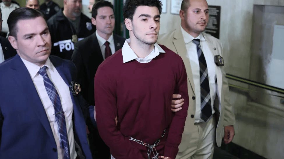 Luigi Nicholas Mangione, center, arrives at Manhattan Criminal Court in New York City, on Dec. 23, 2024. Mangione, 26, is accused of shooting UnitedHealthcare chief executive Brian Thompson on a Manhattan street on December 4.