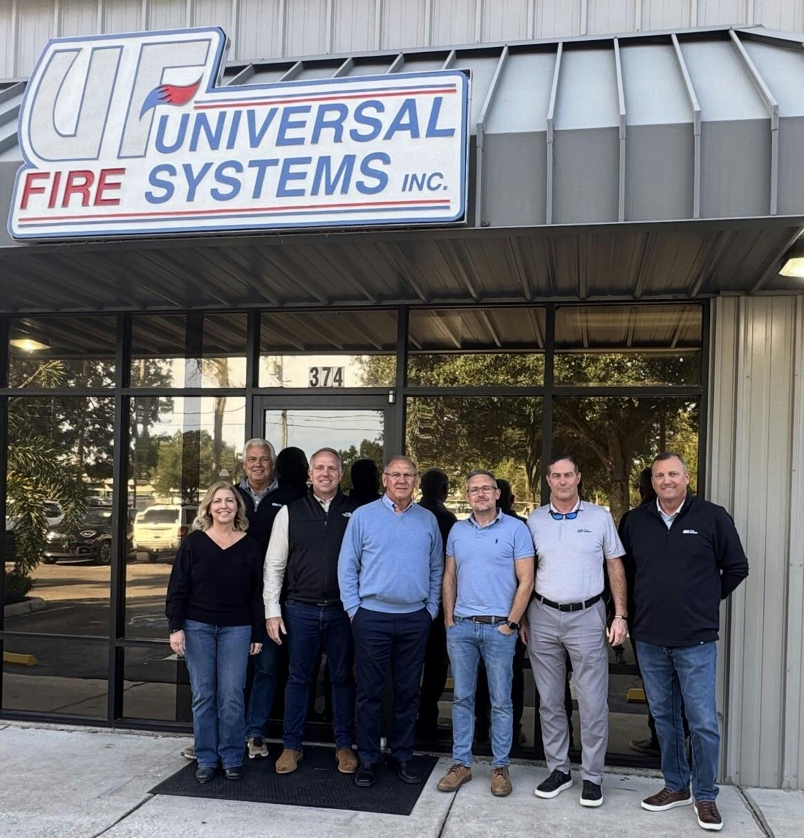 Team members from Universal Fire Systems and Pye-Barker Fire & Safety gather following the announcement of Pye-Barker&rsquo;s acquisition of the Tampa-based fire sprinkler company.