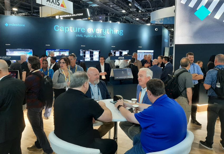 Attendees gather at the Milestone Systems booth during ISC West 2026, where the company highlighted advancements in video management software, AI-driven analytics and cloud-based security solutions.