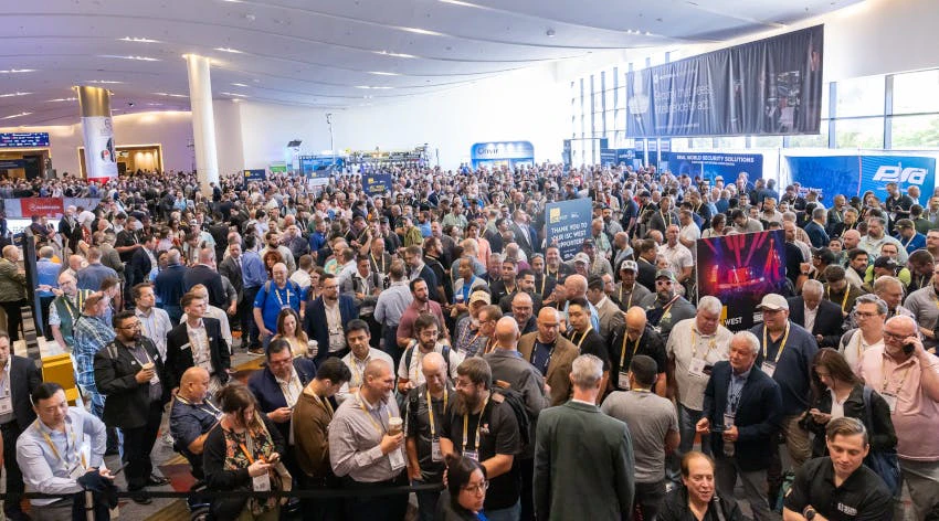 Crowds of ISC West 2026 attendees gather outside the exhibition hall on opening day in Las Vegas, lining up for access to the show floor.