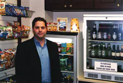 Aaron Speagle of Piedmont Vending Inc. checks on a Freedom Shopping kiosk. Aaron Speagle of Piedmont Vending Inc. checks on a Freedom Shopping kiosk.