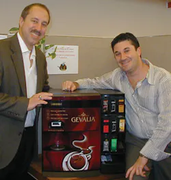 Porcelli explains the Gevalia machine to Drew Warner, American Vending Coffee Service, Mt. Freedom, N.J. Porcelli explains the Gevalia machine to Drew Warner, American Vending Coffee Service, Mt. Freedom, N.J.
