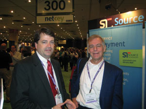 At the Self Service & Kiosk Expo at the Jacob Javits Convention Center in New York city, N.Y., Bill Lynch, left, of Source Technologies discusses the company&rsquo;s latest developments with Jim Phelps of CompuShop Services.