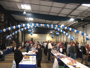 Attendees visit exhibitor booths at Concession Services Inc.&rsquo;s open house in Alsip, Ill.