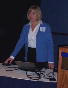 Sandra Larson addresses the government symposium during the NAMA OneShow.