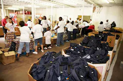 Claremont, North Carolina, volunteers joined with the Second Harvest Food Bank of Metrolina to fill 1,500 take-home backpacks with food for needy children. Claremont, North Carolina, volunteers joined with the Second Harvest Food Bank of Metrolina to fill 1,500 take-home backpacks with food for needy children.