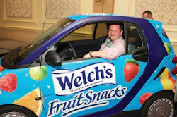 Tim VanGels takes a seat in the Promotion In Motion Smart Car he just won during the Vistar annual meeting at the Chicago Hilton. Tim VanGels takes a seat in the Promotion In Motion Smart Car he just won during the Vistar annual meeting at the Chicago Hilton.