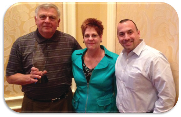 Golick Martin&rsquo;s Joe Lanzilli, left, and Brian Mallahan receive the East Broker of the Year Award from General Mills&rsquo; East Regional Sales Manager, Cyndi Brodt.