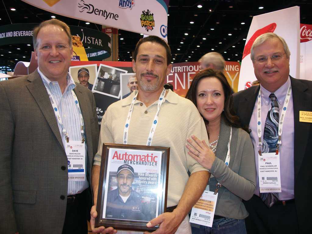 Dave Wilcox (far left) and Paul Schindelar (far right) of Mondelez International present Mike Edwards accompanied by his wife, Jennifer, with the 2013 Route Driver of the Year award. Edwards of Greensboro Vending located in Greensboro, N.C., was selected out of over 100 nominations to win the award. Read more about Edwards at www.vendingmarketwatch.com/11317885.