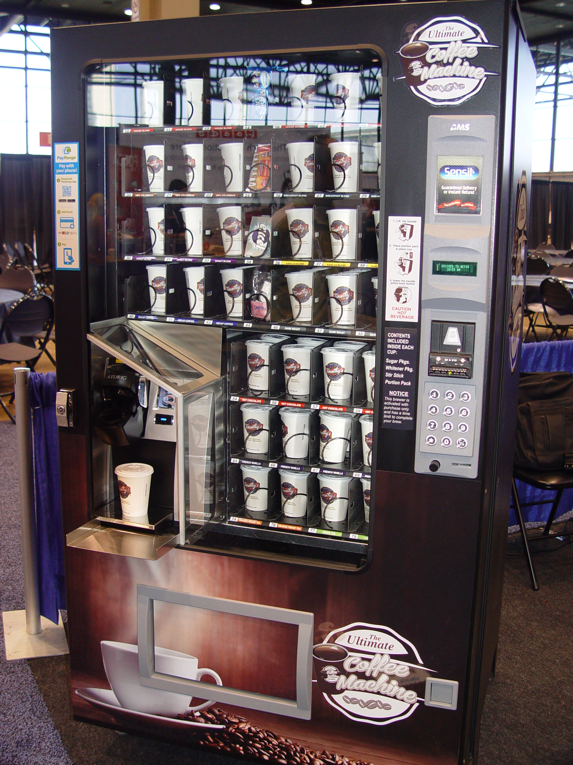The Ultimate Coffee Machine contains seven trays of product which includes up to 180 12-ounce cups. Each cup can be stocked with a single-cup blend and supplies for an individual cup of coffee. The vending machine boasts an integrated authorization unit and is adaptable to most brewer brands. The machine can also hold up to 4 selections of miscellaneous items.