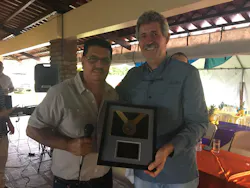 Raul Martinez (right), General Manager of Dole Standard Fruit de Costa Rica, receives a plaque from Jose Miguel Ramirez, General Manager of Recyplast, in recognition of the contribution of Dole's banana plantations in the correct handling, storage, and provision of field plastic waste. Raul Martinez (right), General Manager of Dole Standard Fruit de Costa Rica, receives a plaque from Jose Miguel Ramirez, General Manager of Recyplast, in recognition of the contribution of Dole's banana plantations in the correct handling, storage, and provision of field plastic waste.