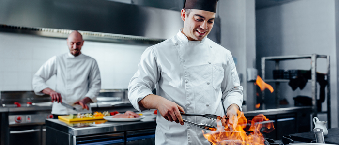 Chef Cooking Over Open Flame 700x300