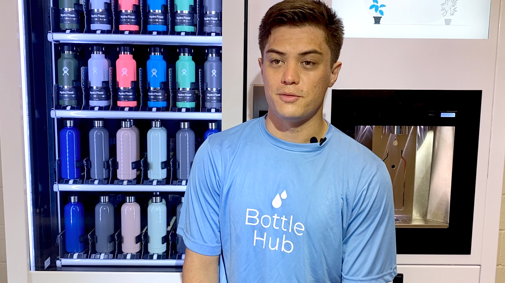 BottleHub founder and chief executive James Trotter shows off kiosk that vends and fills reusable water bottles.