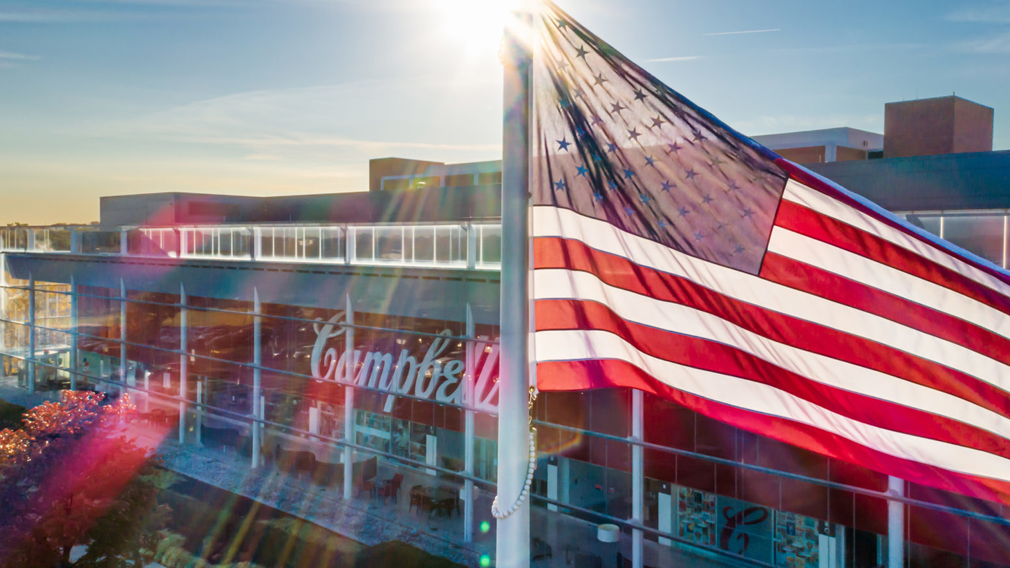 F220192 Comms Veterans Day Flag Raising Drone 7 1 2880x1234 1 2048x878 64c7be51ee69e