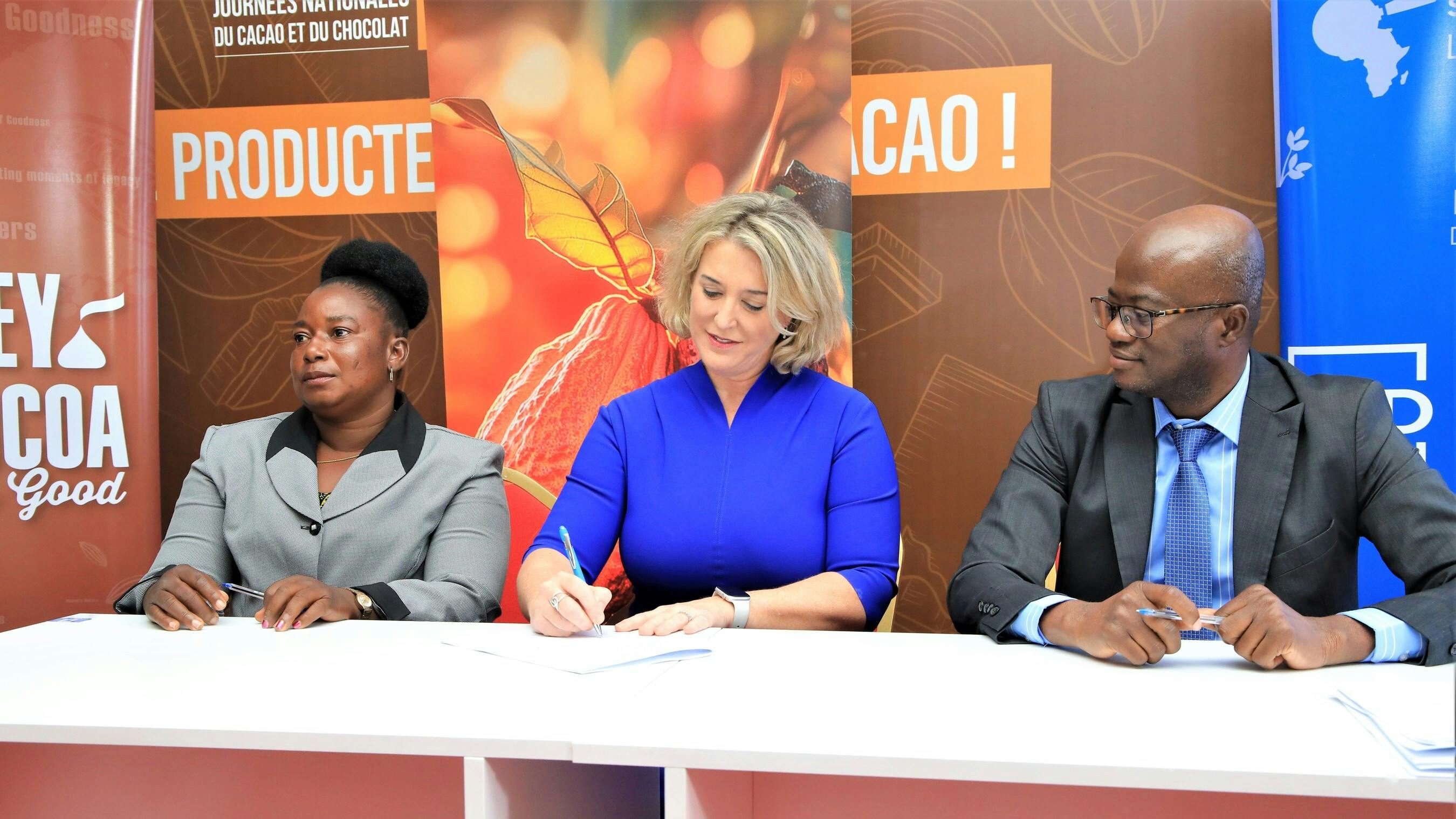 Tricia Brannigan signs MOU on behalf of Hershey with Sucden and nine cooperatives.