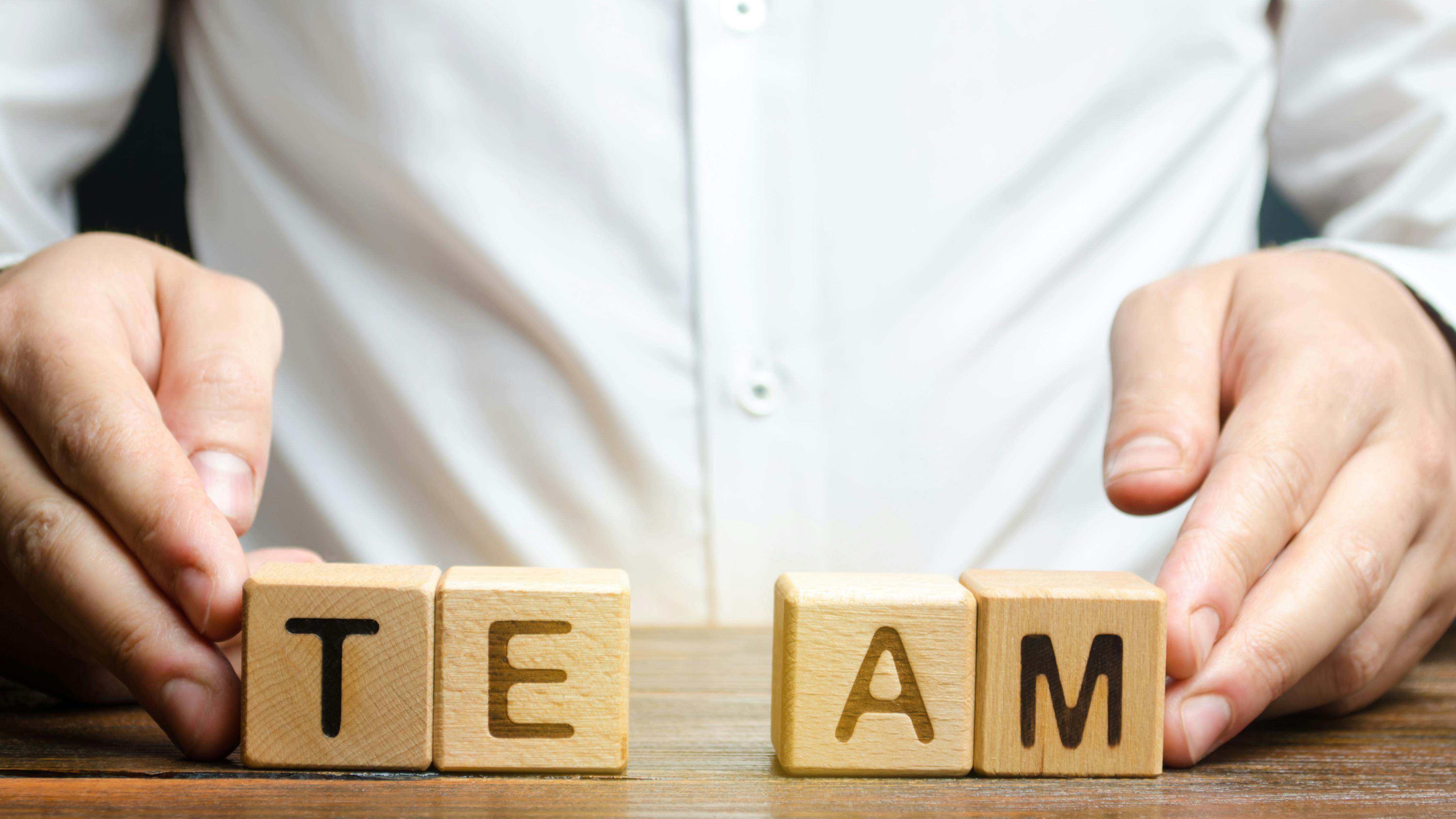 Team spelled out in blocks personnel announcement