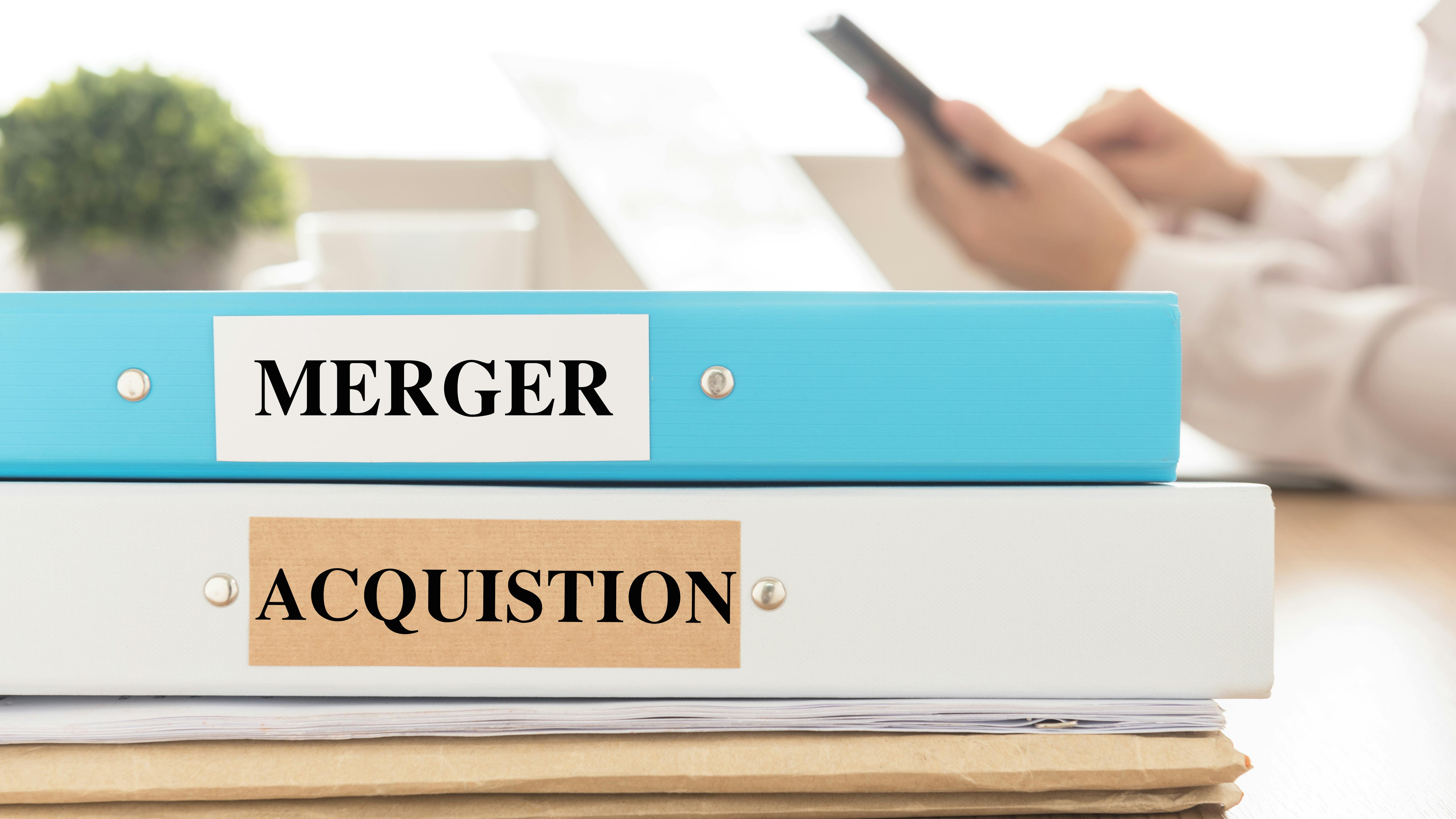 Merger acquistion binders stock art dreamstime_xxl_88312475