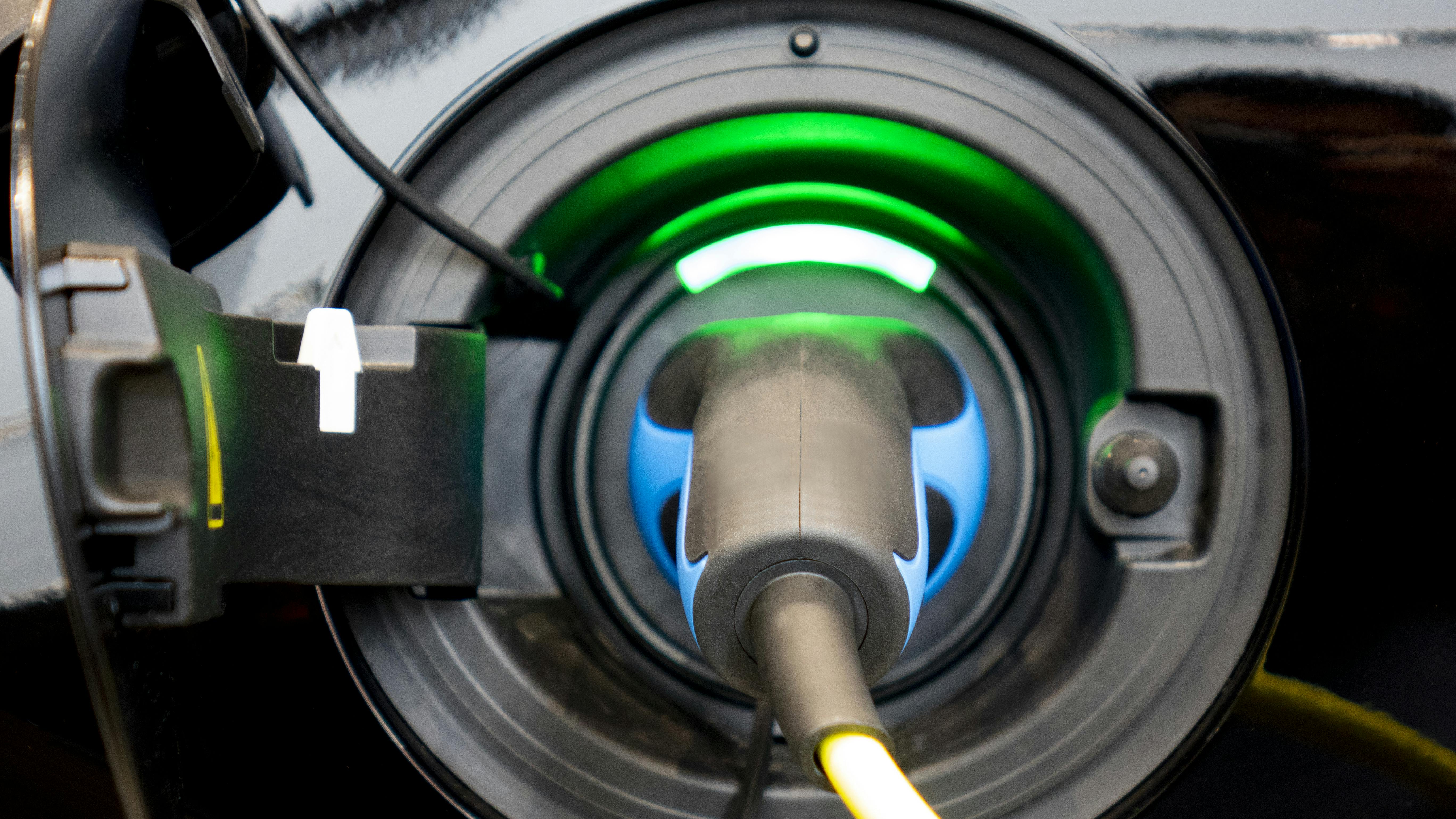 Electric vehicle charging stock image