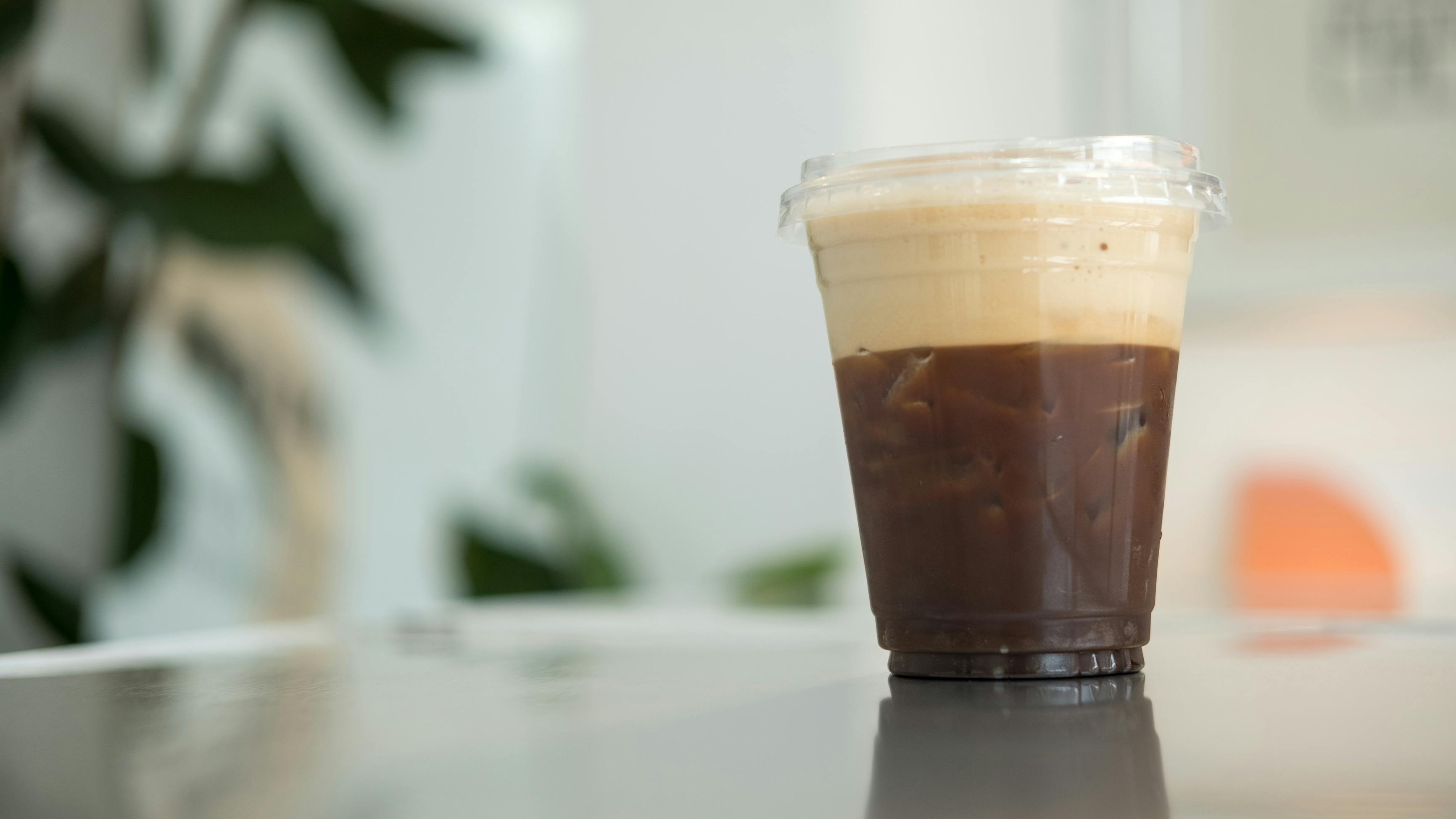 cold brew coffee served in a plastic cup with ice