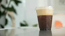 cold brew coffee served in a plastic cup with ice cold brew coffee served in a plastic cup with ice